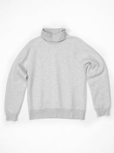 The Charles Turtleneck in grey is 100% cotton.